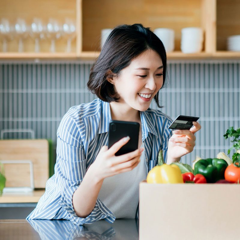 Woman smiling while paying car loan